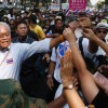 Bangkok protesters collect cash donations for farmers